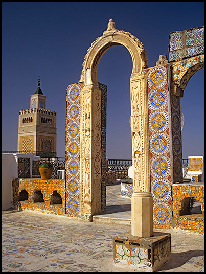 Image of a souk rook roof terrace with a view to the Minaret of Great Mosque