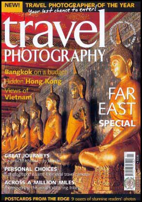 Image of Magazine Front Cover showing a line of Buddhas